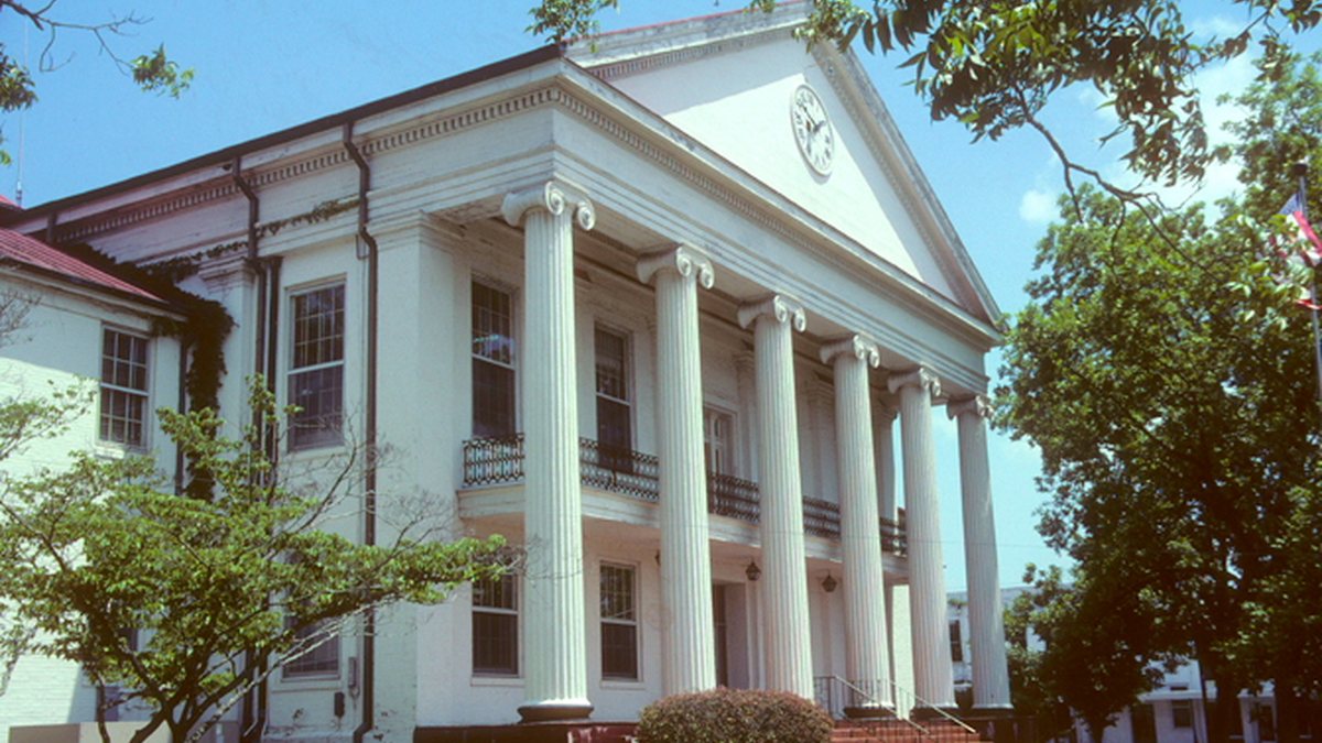 Educational briefing on the Office of the Sheriff for Perry County, Alabama — the city of Marion. Marion County is Hamilton. — educational cover (regional illustration)