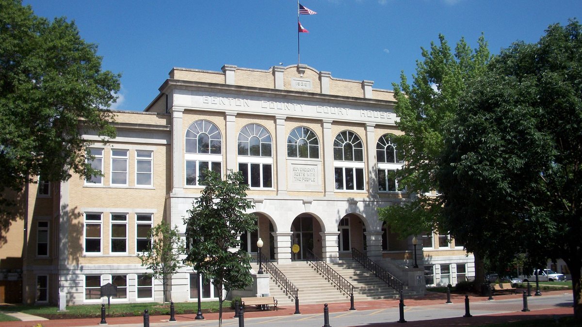 Educational briefing on the Office of the Sheriff for Benton County, Arkansas — Bentonville. Rogers is larger. The city of Benton is Saline County. — educational cover (regional illustration)