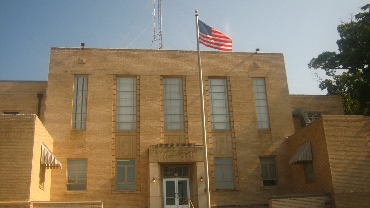 Educational briefing on the Office of the Sheriff for Lafayette County, Arkansas — Lewisville. Not Lafayette, Louisiana. Not Fayetteville. — educational cover (regional illustration)